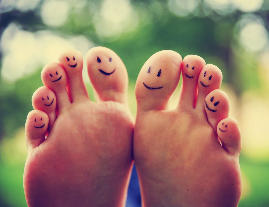 Happy cartoon feet smiling after plantar fasciitis relief